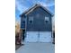 Charming two-story home featuring a two-car garage and sleek, modern design with dark blue siding and white trim at 192 Weldon Rd, Mcdonough, GA 30253