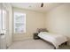 Bedroom with a cozy bed, window, and convenient side table for a peaceful retreat at 3322 Grace Farm Ln, Buford, GA 30519