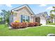 Attractive brick home with well-manicured landscaping and a green lawn at 3322 Grace Farm Ln, Buford, GA 30519