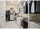Organized walk-in closet with custom shelving and ample storage for clothes and accessories at 3322 Grace Farm Ln, Buford, GA 30519