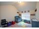 This Bedroom features a vaulted ceiling, a gray crib, and decor accents at 6816 Diamond Dr, Rex, GA 30273