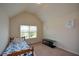 This bedroom features neutral walls, plush carpet, and a window with natural light at 6816 Diamond Dr, Rex, GA 30273