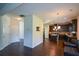 Spacious kitchen with dark cabinetry, a center island, stainless steel appliances, and hardwood floors at 6816 Diamond Dr, Rex, GA 30273
