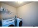 Bright laundry room with modern washer and dryer at 6816 Diamond Dr, Rex, GA 30273