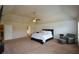 Expansive main bedroom with neutral tones, a ceiling fan and sitting area at 6816 Diamond Dr, Rex, GA 30273