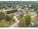 An aerial shot of a home with a circular driveway, beautiful landscaping, and is ready to be yours! at 1032 Jordan Rd, Dacula, GA 30019