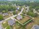 An aerial shot highlights this home's large lot in a quiet, wooded neighborhood at 1032 Jordan Rd, Dacula, GA 30019