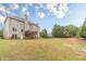 A large, grassy backyard that is perfect for Gathering activities or outdoor events at 1032 Jordan Rd, Dacula, GA 30019