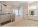 Bathroom featuring a glass enclosed shower, soaking tub, and white tiled floors at 1032 Jordan Rd, Dacula, GA 30019