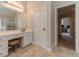 Bathroom featuring tile flooring, white cabinets and a make up vanity at 1032 Jordan Rd, Dacula, GA 30019