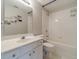 Clean bathroom with a shower-tub combo and white tiled walls at 1032 Jordan Rd, Dacula, GA 30019