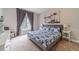 Comfortable bedroom with nautical decor, a window seat, and charming artwork at 1032 Jordan Rd, Dacula, GA 30019