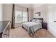 Comfortable bedroom featuring carpeted floors, neutral decor, and natural light at 1032 Jordan Rd, Dacula, GA 30019