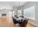 Dining room with plenty of light, a modern chandelier, and views of the living room at 1032 Jordan Rd, Dacula, GA 30019