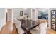 Formal dining room with a large wooden table, upholstered chairs, and elegant lighting at 1032 Jordan Rd, Dacula, GA 30019