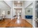 Bright and open foyer with hardwood floors offering seamless flow to the dining room and living room at 1032 Jordan Rd, Dacula, GA 30019