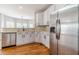 Kitchen featuring stainless steel appliances, ample counter space, and white cabinetry at 1032 Jordan Rd, Dacula, GA 30019