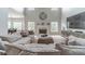 Bright living room with a fireplace, a wall mounted TV, and a comfortable oversized couch at 1032 Jordan Rd, Dacula, GA 30019