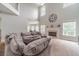Bright living room with a fireplace and large sectional sofa for comfortable relaxation at 1032 Jordan Rd, Dacula, GA 30019