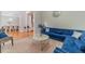Stylish living room with a plush blue sofa, marble coffee table, and neutral carpet for a cozy space at 1032 Jordan Rd, Dacula, GA 30019