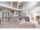 A spacious living room with large sectional sofa, adjacent to a dining area, perfect for entertaining at 1032 Jordan Rd, Dacula, GA 30019