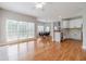 Spacious living area with windows, flowing into the kitchen with a large island and dining area at 1032 Jordan Rd, Dacula, GA 30019