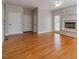 Open living area with hardwood floors, fireplace and a seamless transition to the kitchen and dining areas at 1032 Jordan Rd, Dacula, GA 30019