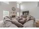 Bright living room featuring a fireplace, a large sectional couch and media center at 1032 Jordan Rd, Dacula, GA 30019