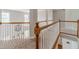 An upstairs hallway overlooks the living room with an upstairs railing at 1032 Jordan Rd, Dacula, GA 30019