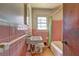 Pink tile bathroom with outdated fixtures; vanity, tub and tile floor needs TLC at 118 Ingleside Dr, Jonesboro, GA 30236