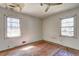 Spacious bedroom needs TLC with hardwood floors and natural light from two windows at 118 Ingleside Dr, Jonesboro, GA 30236
