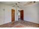 Bedroom featuring hardwood floors, ceiling fan, and two doors at 118 Ingleside Dr, Jonesboro, GA 30236