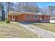 Charming one-story brick home with a covered parking area and a well-maintained front lawn at 118 Ingleside Dr, Jonesboro, GA 30236