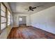 Image shows a living room featuring a ceiling fan and natural light at 118 Ingleside Dr, Jonesboro, GA 30236