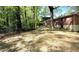 Spacious backyard featuring mature trees and chain link fence at 1655 Tryon Rd, Atlanta, GA 30319