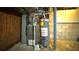 Unfinished basement mechanicals including furnace and water heater at 1655 Tryon Rd, Atlanta, GA 30319