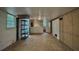 View of the unfinished basement with exposed utilities and some natural light at 1655 Tryon Rd, Atlanta, GA 30319