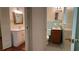 Classic bathroom with light blue accents, dual vanities, and tiled floors at 1655 Tryon Rd, Atlanta, GA 30319