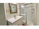 Clean bathroom featuring a stand-up shower, white vanity, and modern mirror at 1655 Tryon Rd, Atlanta, GA 30319