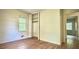 Bedroom with wood floors, closet, and a window overlooking the outdoors at 1655 Tryon Rd, Atlanta, GA 30319
