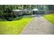 Lovely brick ranch home with an attached carport and long driveway at 1655 Tryon Rd, Atlanta, GA 30319
