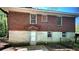 Rear exterior view of the home, showcasing the brick and painted foundation at 1655 Tryon Rd, Atlanta, GA 30319