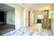 Hallway with marble floors leading to the kitchen with gray cabinets at 1655 Tryon Rd, Atlanta, GA 30319