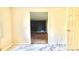 Hallway leading to a room with dark blue accent wall and hardwood floors at 1655 Tryon Rd, Atlanta, GA 30319