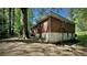 Exterior of home showcasing brick and siding and mature trees in the backyard at 1655 Tryon Rd, Atlanta, GA 30319