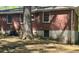 Exterior of home showcasing brick and siding and mature trees in the backyard at 1655 Tryon Rd, Atlanta, GA 30319