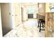 Classic kitchen with breakfast bar and marble tile flooring at 1655 Tryon Rd, Atlanta, GA 30319