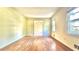 Bright living room featuring beautiful hardwood floors and a sunlit window at 1655 Tryon Rd, Atlanta, GA 30319