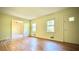 Light-filled living room with hardwood floors, and large windows at 1655 Tryon Rd, Atlanta, GA 30319