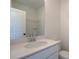 Clean bathroom featuring a white vanity with sink and a large mirror at 1899 Deco Dr, Kennesaw, GA 30144
